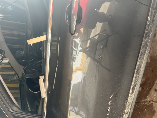 Dark door panel after the crease repair