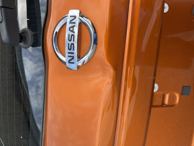 Orange hatch before repair, with a dent across the body line