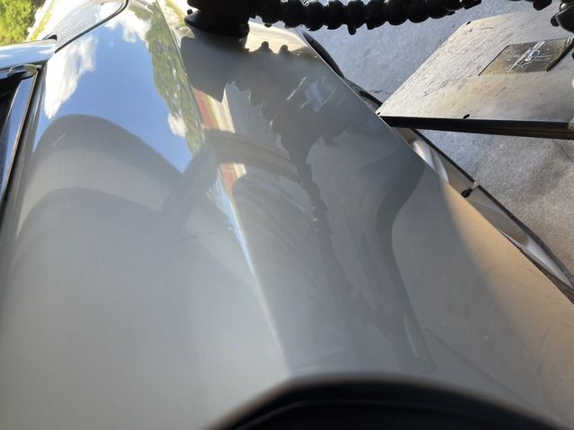Light silver rear quarter panel after the body-line repair
